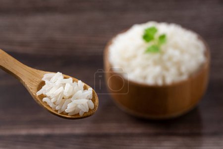 Rice cooked in wooden spoon.