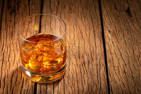 Photo for Glass with whiskey and ice cubes. - Royalty Free Image