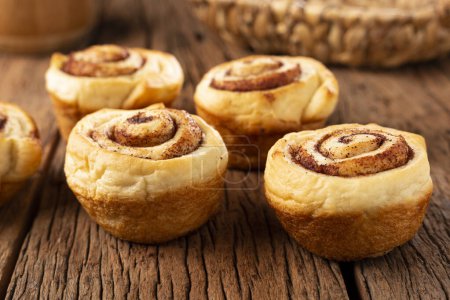 Photo for Cinnamon rolls on wooden background. - Royalty Free Image