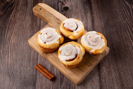 Photo for Cinnamon rolls on wooden background. - Royalty Free Image