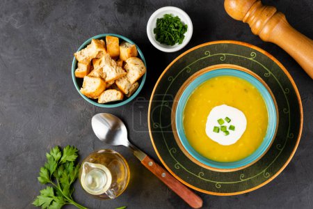 Photo for Bowl with pumpkin soup on the table. - Royalty Free Image