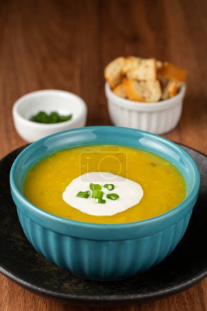 Photo for Bowl with pumpkin soup on the table. - Royalty Free Image
