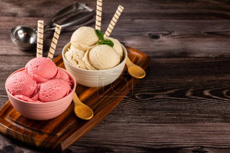 Photo for Bowls with strawberry and vanilla ice cream. - Royalty Free Image