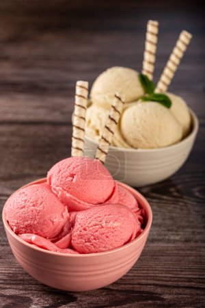 Photo for Bowls with strawberry and vanilla ice cream. - Royalty Free Image