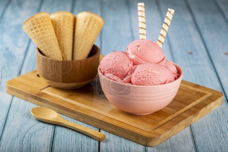 Photo for Bowl with strawberry ice cream balls. - Royalty Free Image