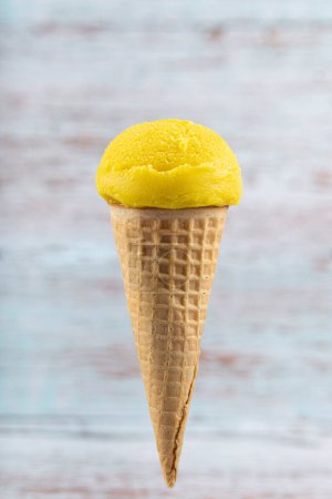 Photo for Tasty pineapple flavored ice cream cone. - Royalty Free Image