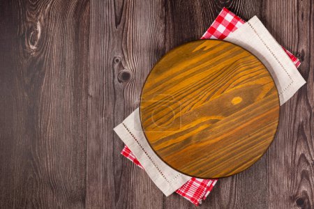 Photo for Empty pizza board on rustic wooden table. Top view image. - Royalty Free Image
