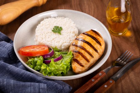 Photo for Grilled chicken with salad and rice. - Royalty Free Image