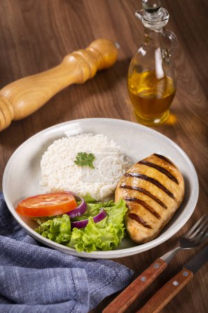 Photo for Grilled chicken with salad and rice. - Royalty Free Image