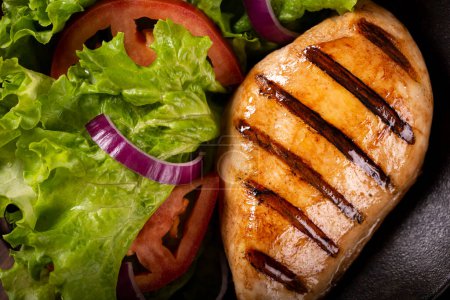 Photo for Tasty grilled chicken with salad. - Royalty Free Image