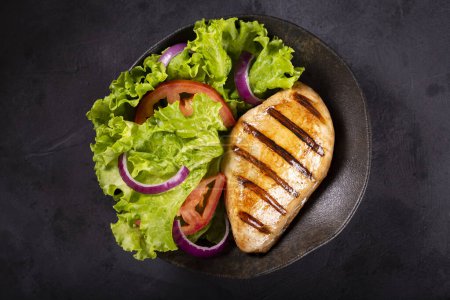 Photo for Tasty grilled chicken with salad. - Royalty Free Image