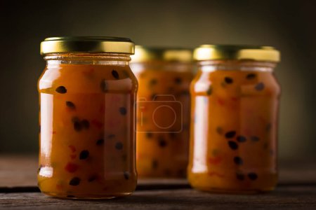 Photo for Pepper jam with passion fruit in glass jars. Passion fruit jam with pepper. - Royalty Free Image