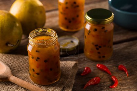 Pepper jam with passion fruit in glass jars. Passion fruit jam with pepper.