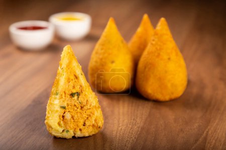 Photo for Coxinha of chicken, Traditional brazilian snack. - Royalty Free Image
