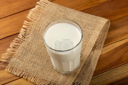Photo for Glass of milk on the wooden table. - Royalty Free Image