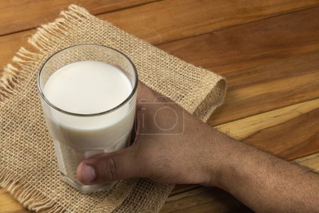 Photo for Glass of milk on the wooden table. - Royalty Free Image