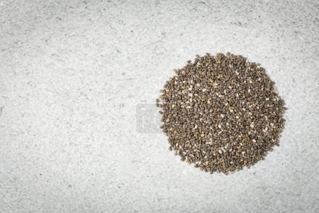 Chia seeds in bowl on the table.