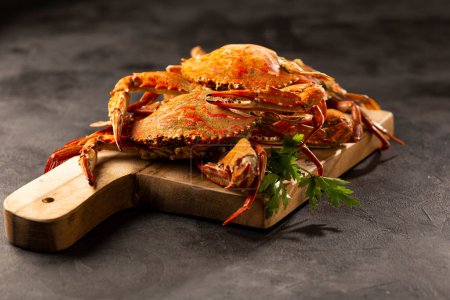 Dish of cooked crabs on the table.
