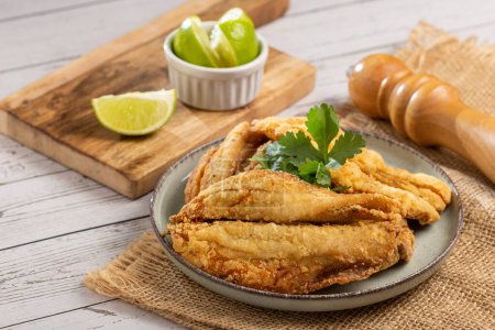 Sardine fried fish on plate.
