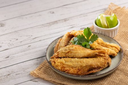 Sardine fried fish on plate.