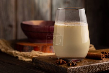 Photo for Eggnog cup with cinnamon powder. - Royalty Free Image