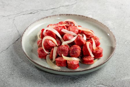 Photo for Portion of sausage with onion. - Royalty Free Image