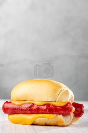 Photo for Sausage sandwich with melted cheese. - Royalty Free Image
