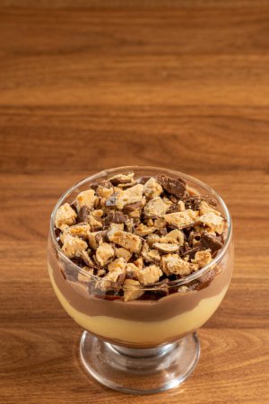 Photo for Dessert in the glass. Pastry cream dessert with chocolate ganache. - Royalty Free Image