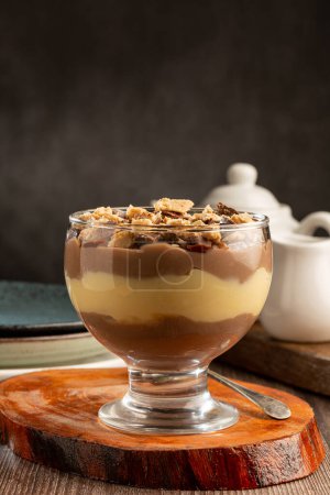 Photo for Dessert in the glass. Pastry cream dessert with chocolate ganache. - Royalty Free Image