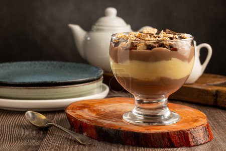 Dessert in the glass. Pastry cream dessert with chocolate ganache.