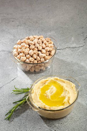 Chickpeas hummus with olive oil in the bowl.