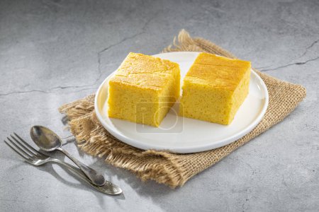 Photo for Sliced cornmeal cake on the table - Royalty Free Image