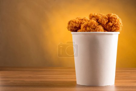 Crispy fried chicken in the bucket. Chicken bucket.