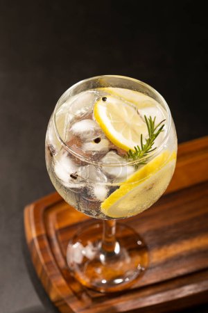 Photo for Gin Tonic garnished with lemon and rosemary. - Royalty Free Image