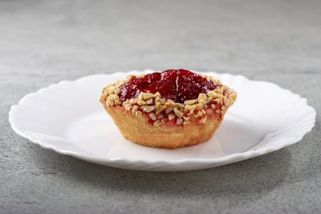 Delicious strawberry tartlet on the table.
