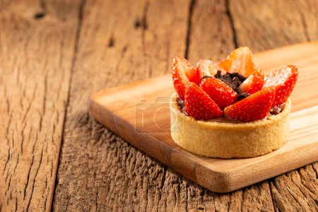 Photo for Tasty strawberry tartlet on the table. - Royalty Free Image