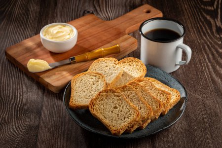 Healthy wholemeal toast with butter and coffee.