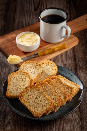 Photo for Healthy wholemeal toast with butter and coffee. - Royalty Free Image