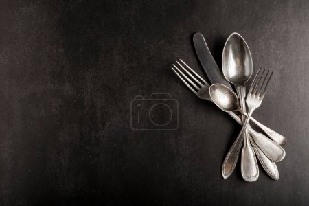 Photo for Antique cutlery on the table. Vintage cutlery. - Royalty Free Image