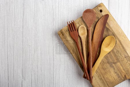 Photo for Wooden cutlery on wooden table. - Royalty Free Image