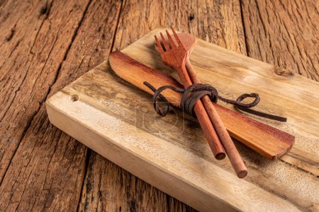 Photo for Wooden cutlery on wooden table. - Royalty Free Image