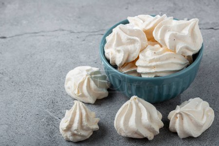Delicious meringue cookies in the bowl.