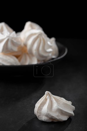 Delicious meringue cookies on the table.