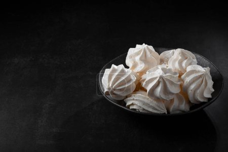 Delicious meringue cookies on the table.