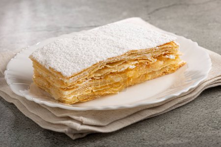 Mille feuille dessert on the plate.