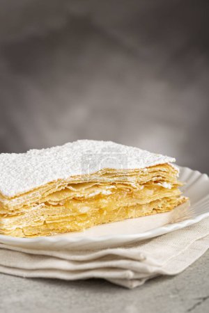 Mille feuille dessert on the plate.