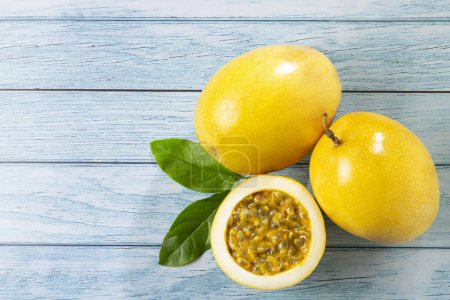 Photo for Yellow passion fruit sliced on the table - Royalty Free Image
