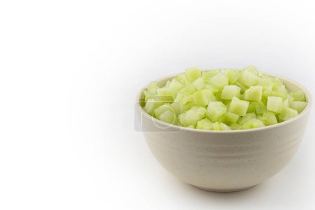 Photo for Chayote cubes in bowl isolated on white background. - Royalty Free Image