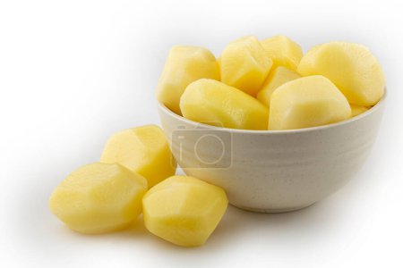 Peeled raw potatoes isolated on white background.