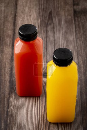 Healthy fruit smoothies in plastic bottles.